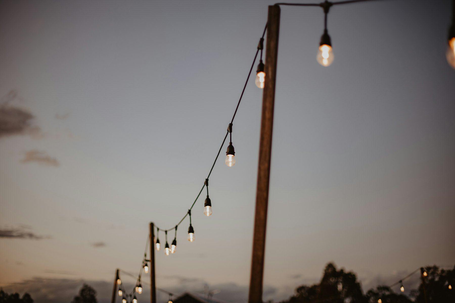 String lights against a dusk sky
