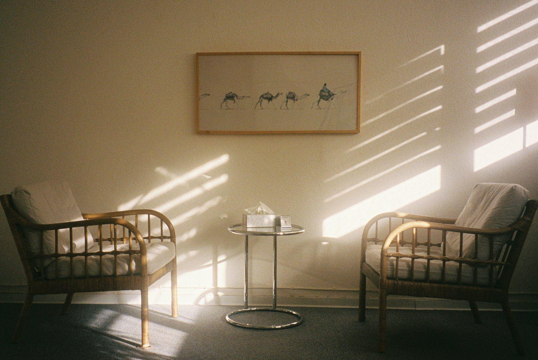Two chairs facing each other in afternoon light