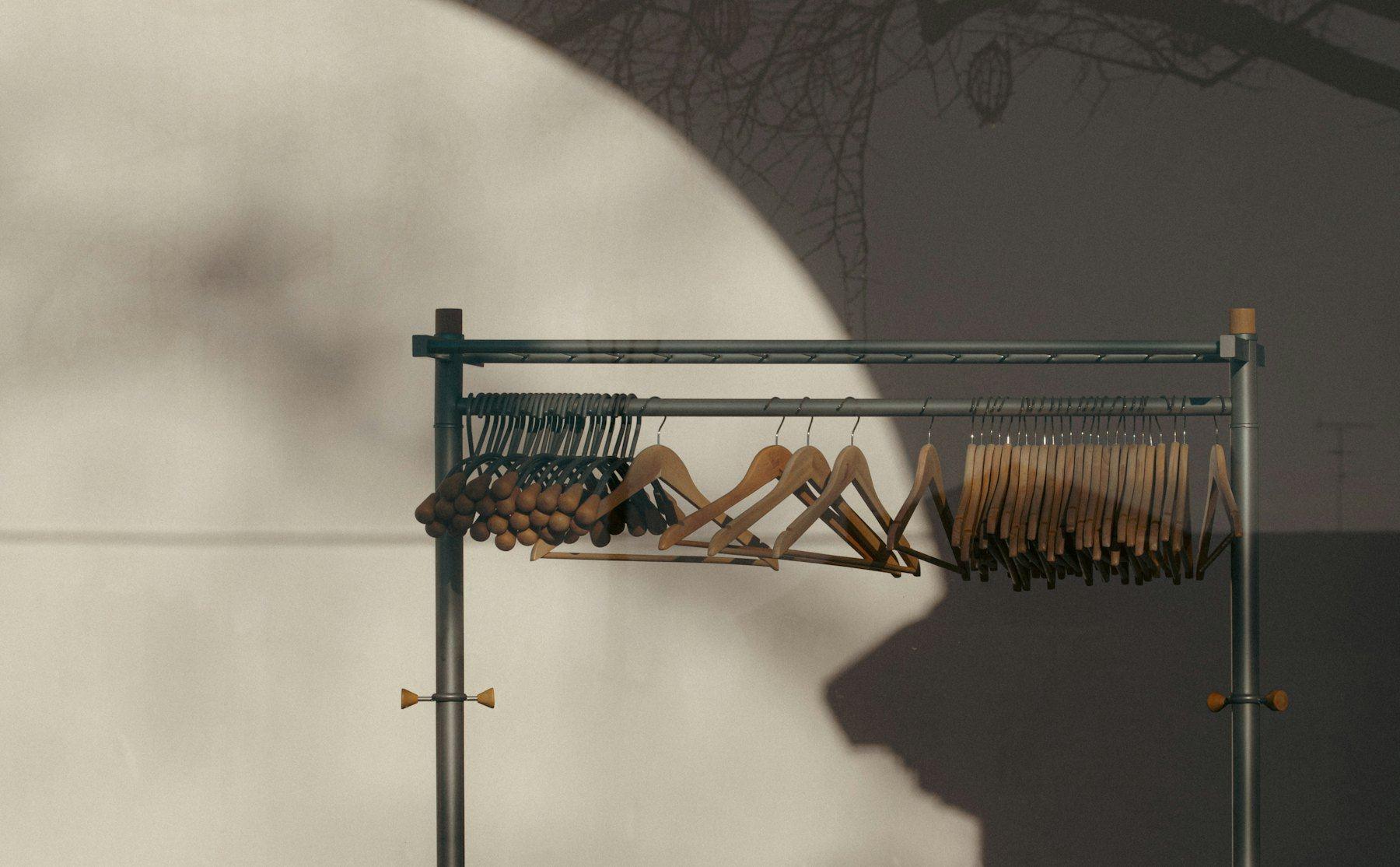 A garment rail in afternoon light and shadow